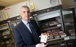 Dr. Dean Fergusson holds a bag of blood.